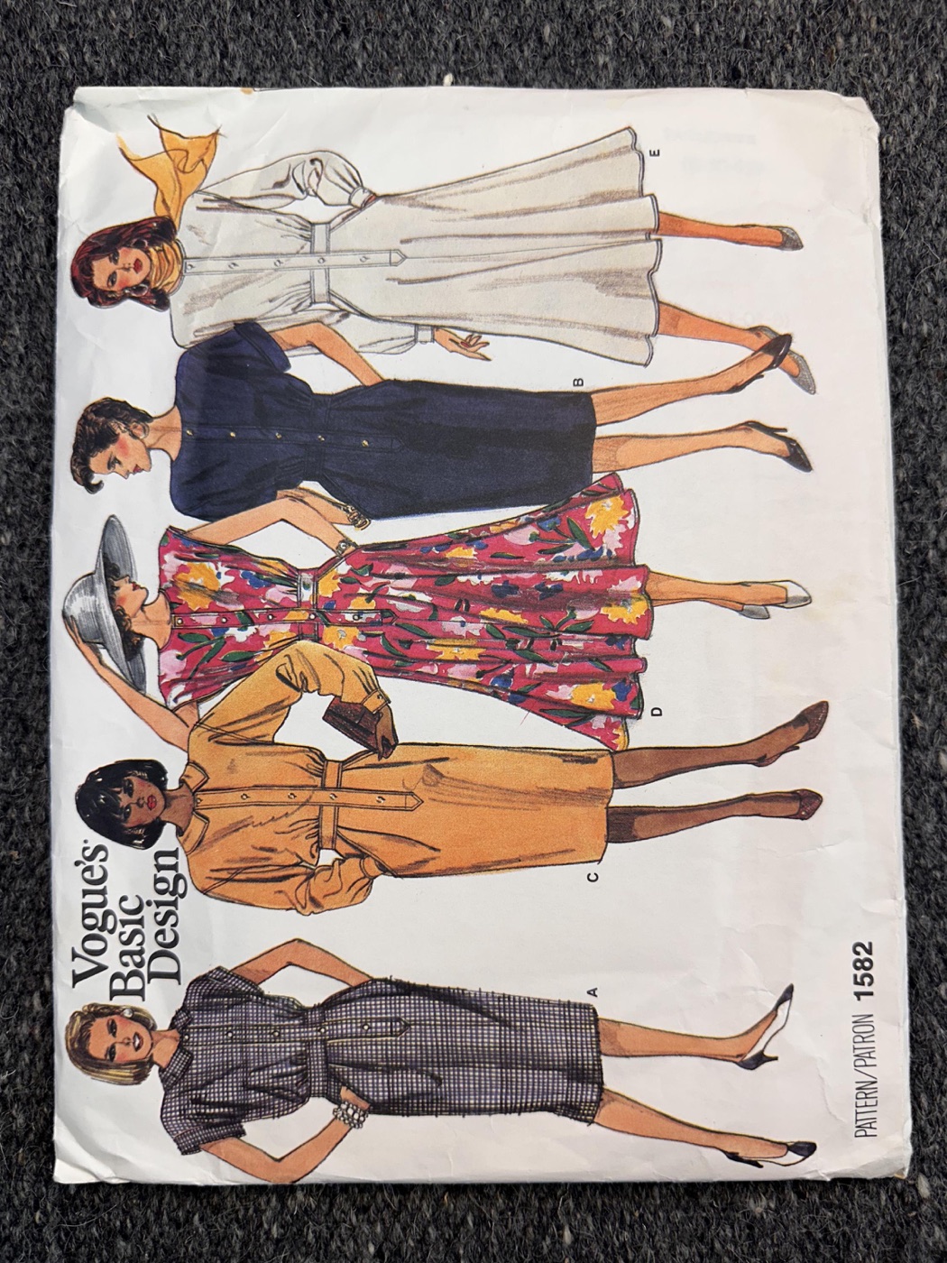 Vogue 1582 pattern envelope showing five illustrated button-front dress variations